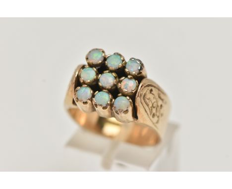 A 9CT GOLD OPAL RING, large square shape ring, set with nine circular cut opal cabochons, each in a claw setting, on a raised