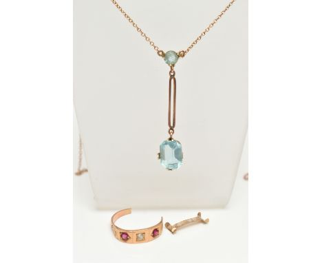 A ROSE METAL PENDANT NECKLACE AND A RING, the drop pendant set with a rectangular cut and circular cut light blue paste, each