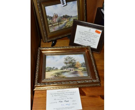 TWO GILT FRAMED ROYAL WORCESTER PORCELAIN PLAQUES, comprising two rectangular porcelain plaques, one decorated with a river s