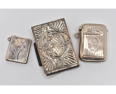 THREE EARLY 20TH CENTURY SILVER ACCESSORIES, to include an Edwardian embossed silver fronted notebook, hallmark for Arthur Jo