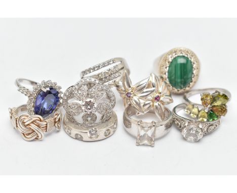 TEN RINGS, to include a large silver malachite cabochon dress ring, claw set within a beaded surround, to a polished band, ha