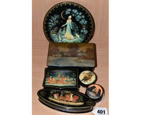 A COLLECTION OF RUSSIAN LACQUER ART BOXES AND PLAQUE, comprising a circular plaque, a cigarette box depicting a Village Winte