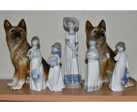 FIVE NAO FIGURES AND TWO FIGURES OF GERMAN SHEPHERD DOGS, the Nao figures comprising a girl with a posy of flowers, a girl ho