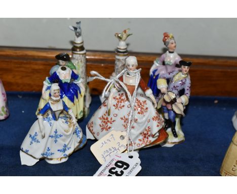 SEVEN 20TH CENTURY FIGURAL PORCELAIN SCENT BOTTLES, comprising two Sitzendorf examples, one having a blue and white floral dr