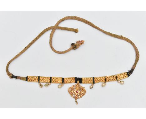 AN INDIAN NECKLACE, designed with a central fancy floral and beaded pendant with central ruby suspending an imitation pearl, 