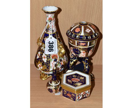 A GROUP OF ROYAL CROWN DERBY IMARI PATTERN PORCELAIN, comprising a 6299 pattern footed vase with gilt foliate handles, date c