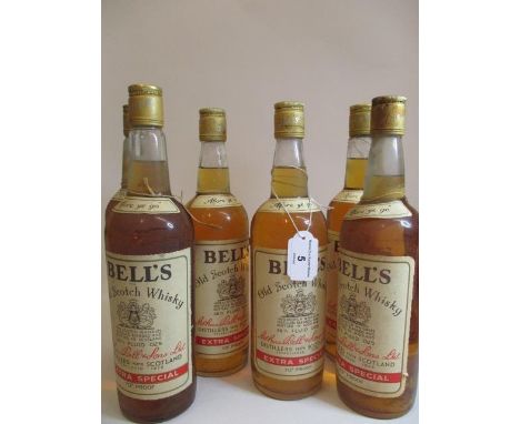 Six 26 2/3 fl oz bottles of Bells Old Scotch Whisky 
