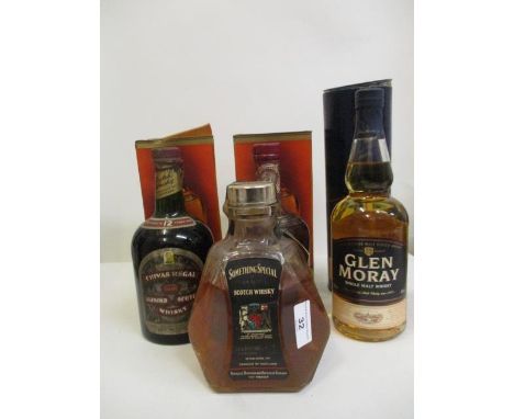 Four bottles of Scotch Whisky to include Chivas Regal, Glen Moray and Something Special 