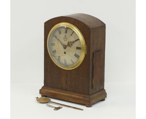 A World War 2 RAF Officer’s Mess Eight Day Fusee Mantle Clock by FW Elliott Ltd, the silvered dial is enclosed behind a brass