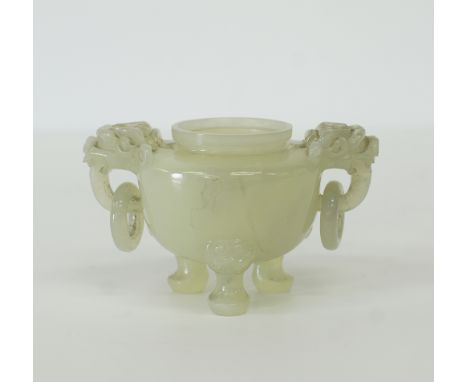 A Chinese jadeite tripod carving of an incense burner, the compressed circular body with two elaborate animal handles with lo