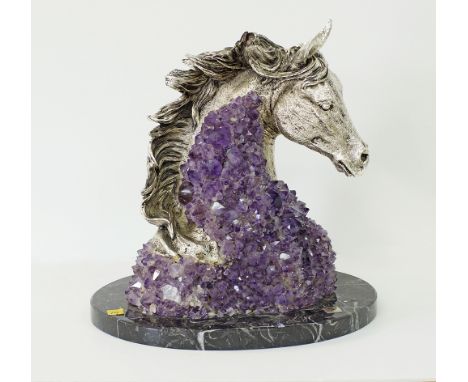 An Ebano Spanish sculpture of a silvered horse head mounted on Amethysts, on a black marble plinth, marked "Ric-Art" Made in 