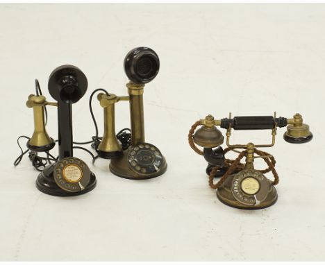 A collection of vintage telephones comprising a Brushed 1930's Style Cradle Telephone, a black candlestick telephone and a br