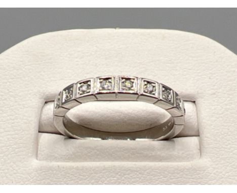 Ladies 9ct white gold diamond 9 stone band. Comprising of 9 round brilliant cut diamonds. Approx .35ct 2.9g size O