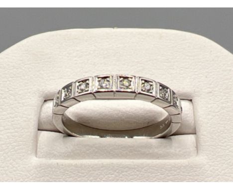 Ladies 9ct white gold diamond 9 stone band. Comprising of 9 round brilliant cut diamonds. Approx .35ct 2.9g size O