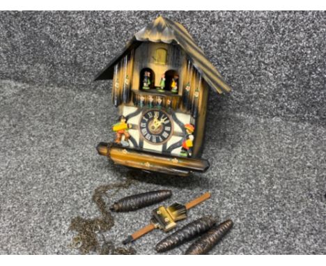 Wicker twin handled basket containing a vintage German hand-painted novelty cuckoo clock, with original pendulum &amp; 3 weig