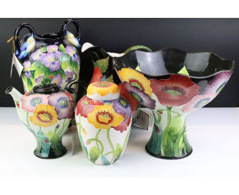 Group of five pieces of Blue Sky pottery with tube lined floral decoration, to include a Wisteria vase, Hibiscus Pitcher (bla