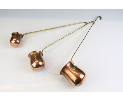 Set of Three Copper graduating hanging Spirit Measures / Ladles with brass labels for Whisky, Brandy and Rum, longest 39cms 