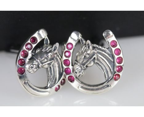 Pair of silver and ruby horse shaped cufflinks 