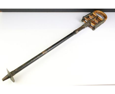 Vintage W Thornhill &amp; Co shooting stick having an ebonised wooden column with bamboo top and 'The Beaumont' makers label.