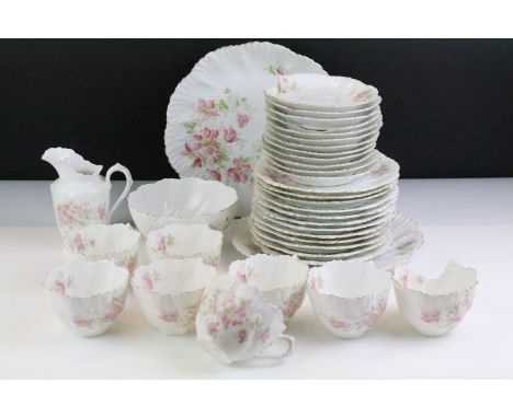 Early 20th Century tea service having a white ground with pink floral sprays and gilt rims. Marked 441 20 to bases. Housed wi