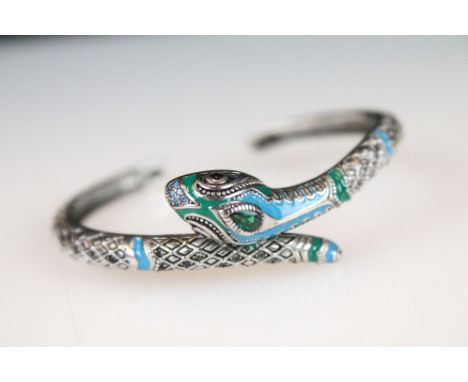 A ladies bangle bracelet with enamel decoration in the form of a snake, marked 925 to the verso. 