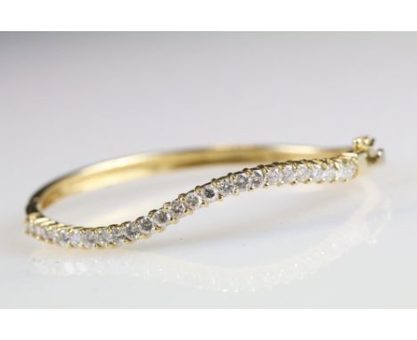 18ct yellow gold serpentine shaped diamond bangle 