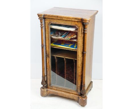 19th Century Victorian inlaid walnut music cabinet having a glass panelled door to front housed between two turned columns, a