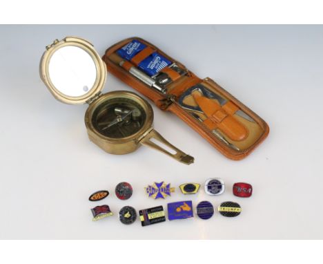 Stanley of London brass compass together with a small collection of motorcycling enamel badges (Triton, BSA, Triumph, etc) an