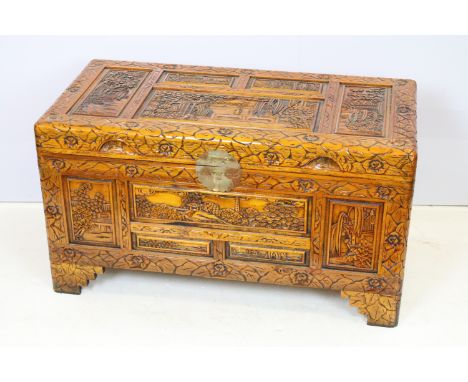 20th Century Chinese carved trunk having panelled detailing with hinged lid raised on bracket feet. Measures 87cm wide. 