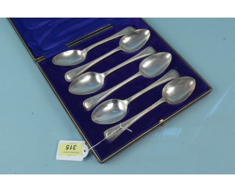A cased set of six Victorian silver bead pattern spoons, each with engraved dog crest, hallmarked Sheffield, Henry Wilkinson 