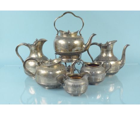 A five piece tea service including tea and coffee pots, milk and jug and spirit kettle together with a matched water jug, eac