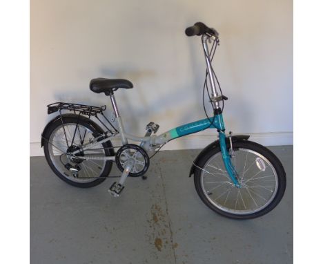 A Compass folding cycle and helmet in as new condition 