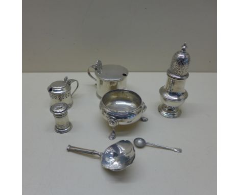 Six silver cruet items and a silver caddy spoon - weighable silver approx 12 troy oz - small mustard damaged, others generall