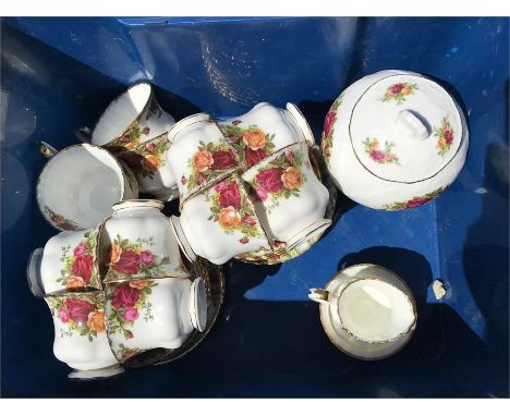 Royal Albert, old country roses tea service, 12 cups/saucers/plates, milk and sugar and lidded vase, repair to base of jug. 