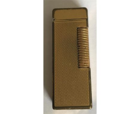 A vintage gold plated Dunhill rollagas lighter 