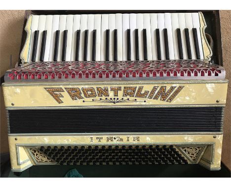 A cased Frontalini piano accordion 