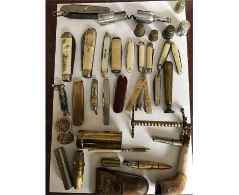 A large collection of miscellaneous to include penknives, thimbles, a bullet lighter, cuff links, 