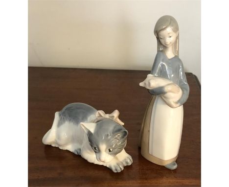 Lladro figure of lady and a pig 17.5 cm high with a Nao figure of a cat