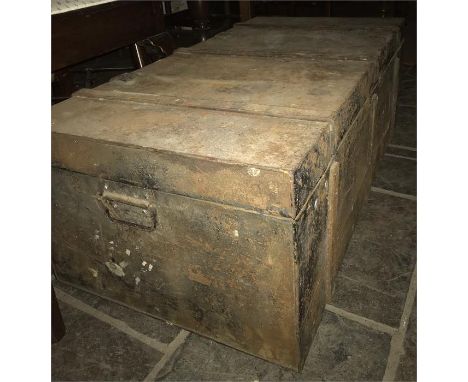 A tin trunk and contents to include soda syphons 