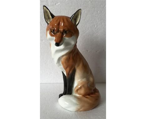  A Royal Worcester figure of a seated fox. 20 cms - excellent condition. 