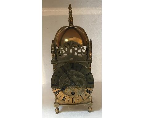Reproduction brass mantle clock - 27cms tall 