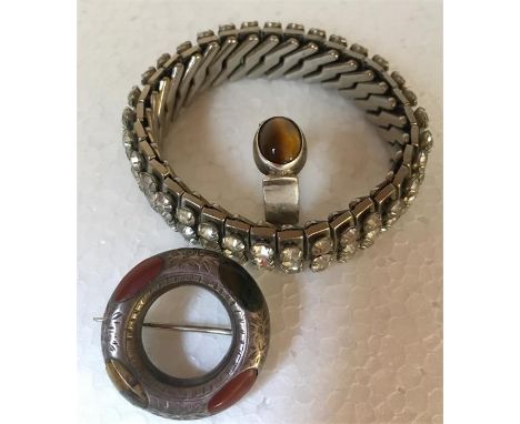 Three pieces of vintage jewellery to include expanding diamanté bracelet, silver and tigers eye ring and Celtic brooch