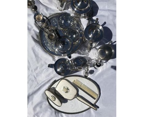 A quantity of silver plated wear including tea service, candelabra, dressing table set etc.