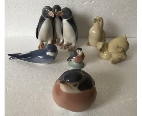 Four Royal Copenhagen figures of birds and two NAO figures of birds. All in good condition except the small bird with chip to