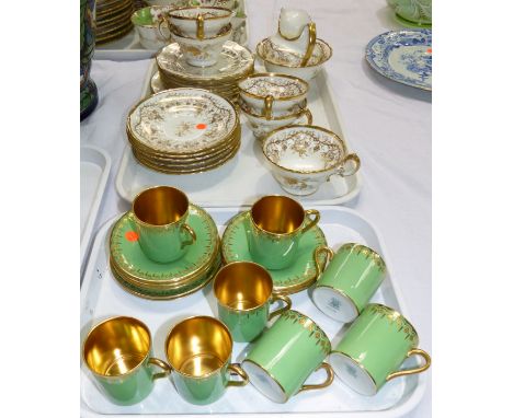 A set of 8 Coalport coffee cans; 8 various saucers; a Cauldon part tea set