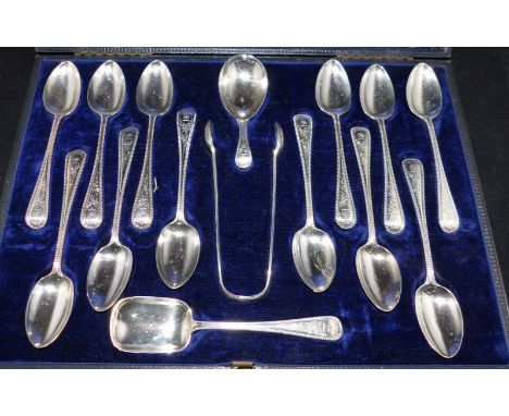 A mid Victorian set of 12 beaded Old English pattern teaspoons with engraved decoration, complete with sugar tongs, preserves