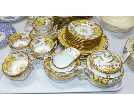 A Coalport bone china part tea service, yellow ground, 34 pieces