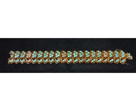An 18 carat hallmarked gold bracelet by B&R Ltd, formed from rows of 3 heart shaped links, each set with turquoises, interspe
