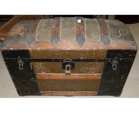 A 19th century dome top wood bound cabin trunk