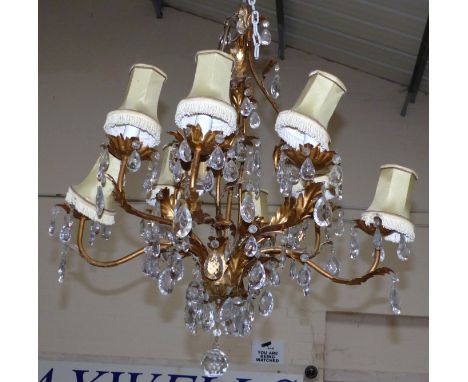 An 8-branch rococo style pendant ceiling light with faceted glass drops